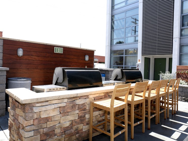 Community BBQ area with seating and counter